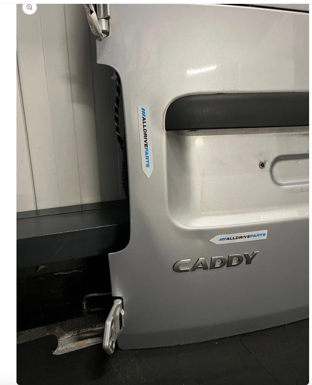 VW Caddy Tur hinten links silber